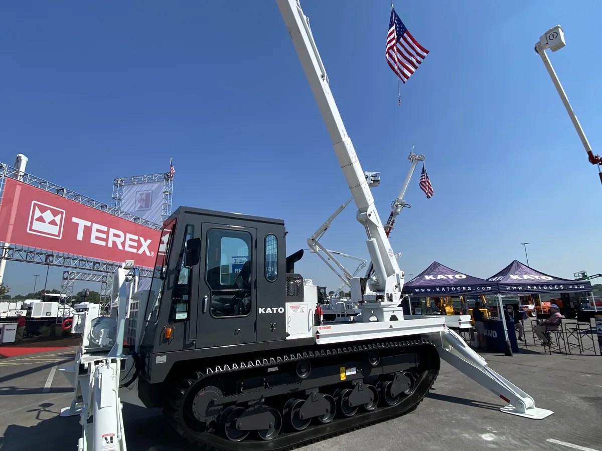 Digger derrick setting a utility pole